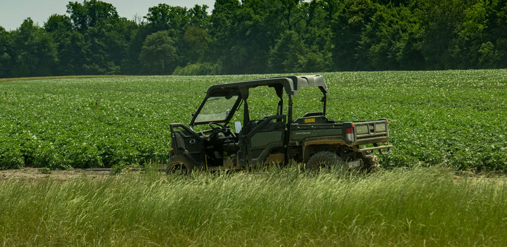 Utility vehicle parked at a field edge during an on-site consulting visit near Stephenville, Texas